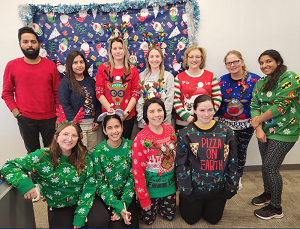 Group of VON staff wearing holiday sweaters