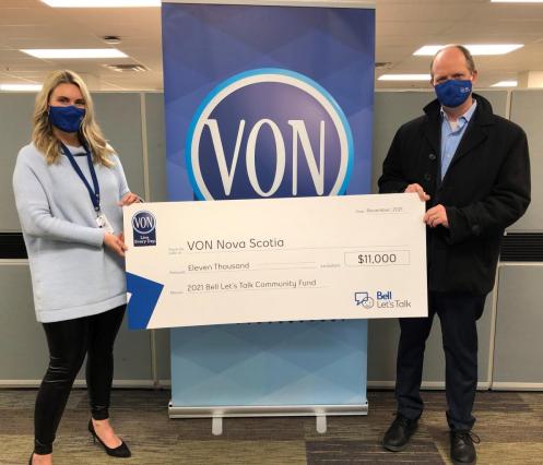VON staff receiving oversized cheque from Bell representative