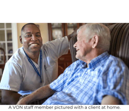 A VON Staff member (male) with a senior male client in their home.