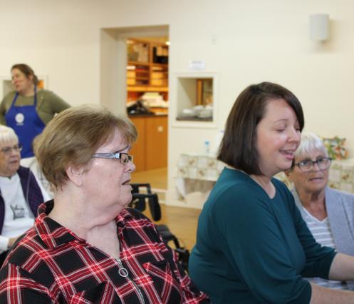 Group of women enjoying a sing-a-long