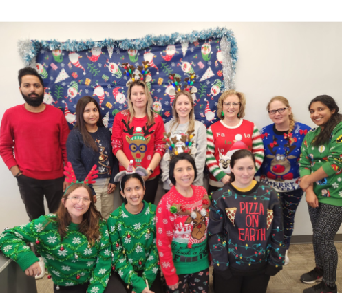 Group of VON staff wearing festive holiday sweaters