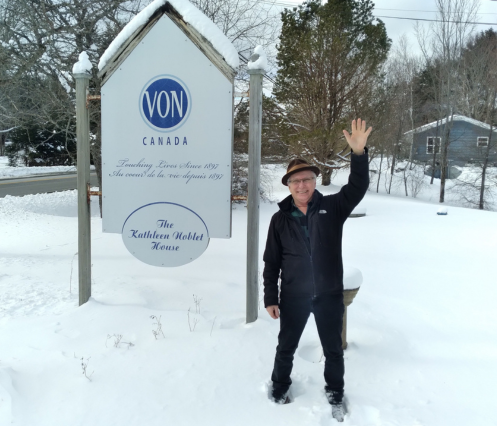 VON Volunteer in front of VON sign