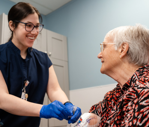 Nurse smiling at patient