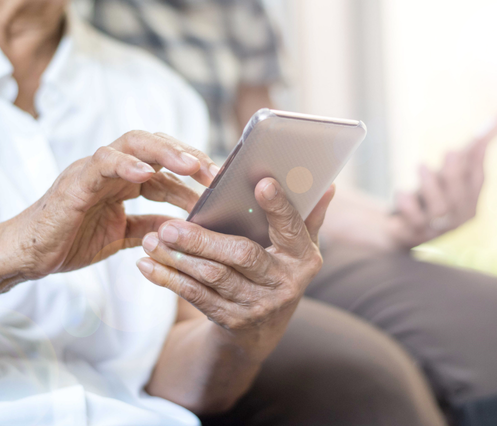 A person holding a phone scrolling. 