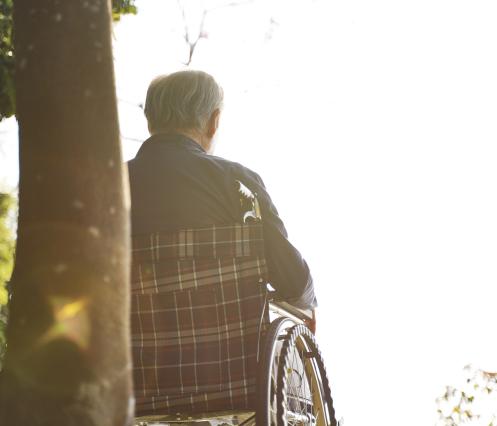 istock man outside in wheelchair