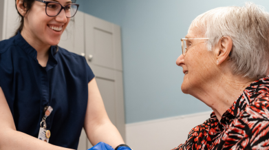 Nurse smiling at patient